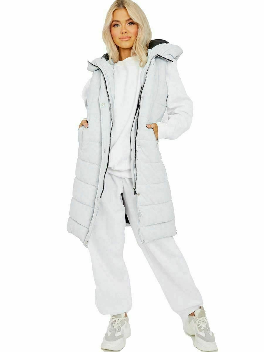Ladies Long Length White Padded Gilet, Split Side Zips, Length Is 36 Inches (91cm), Sizes 8, 10, 12, 14, Has A Front Zip Fastening And Pockets At The Side, It Is 100% Polyester